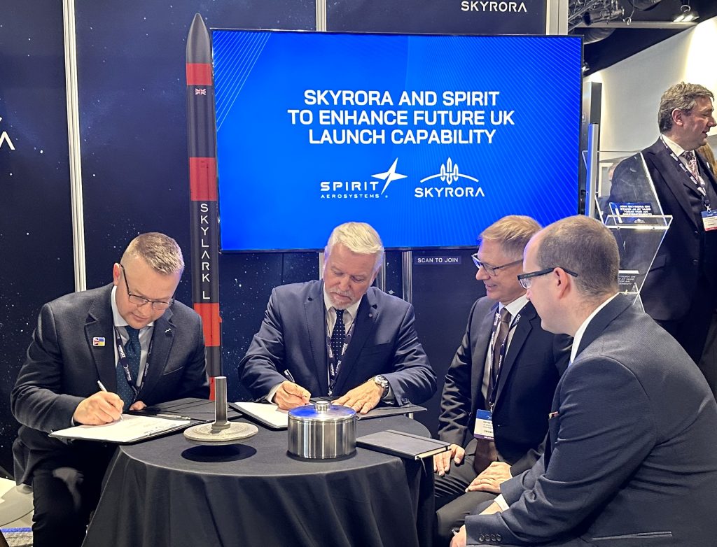 Signing contract at UK space conference