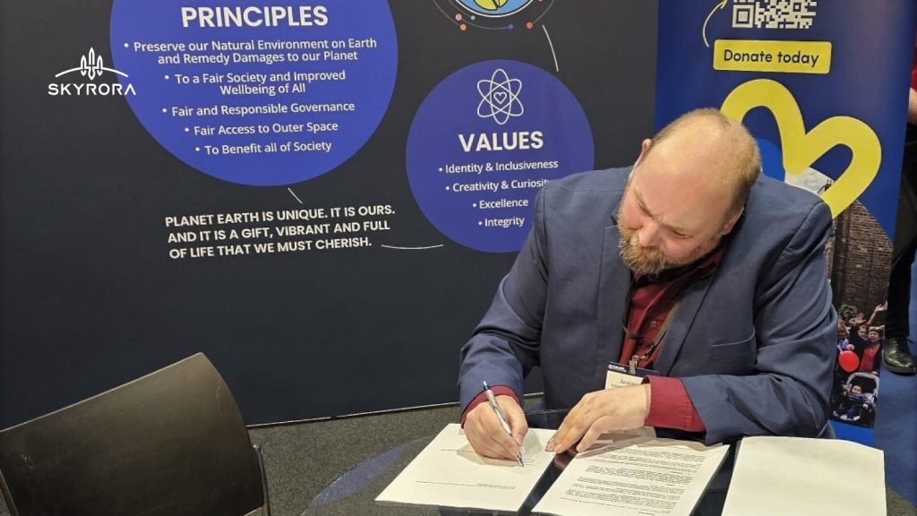 Derek Harris signing ESA statement for a responsible Space